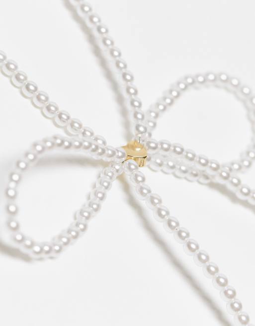 Reclaimed Vintage skinny pearl bow necklace | ASOS