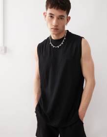 Reclaimed Vintage shorter length jersey shorts in black
