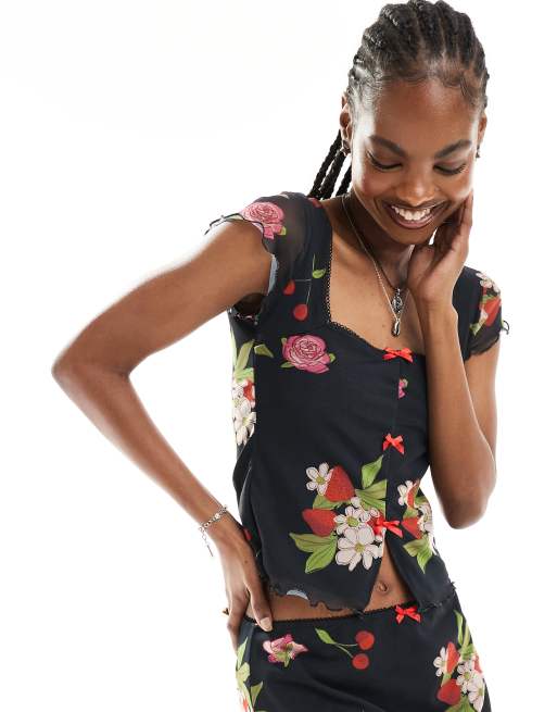 Reclaimed Vintage - Sort babydoll-top med pufærmer, sløjfer og blomster- og frugtprint i vintage-stil