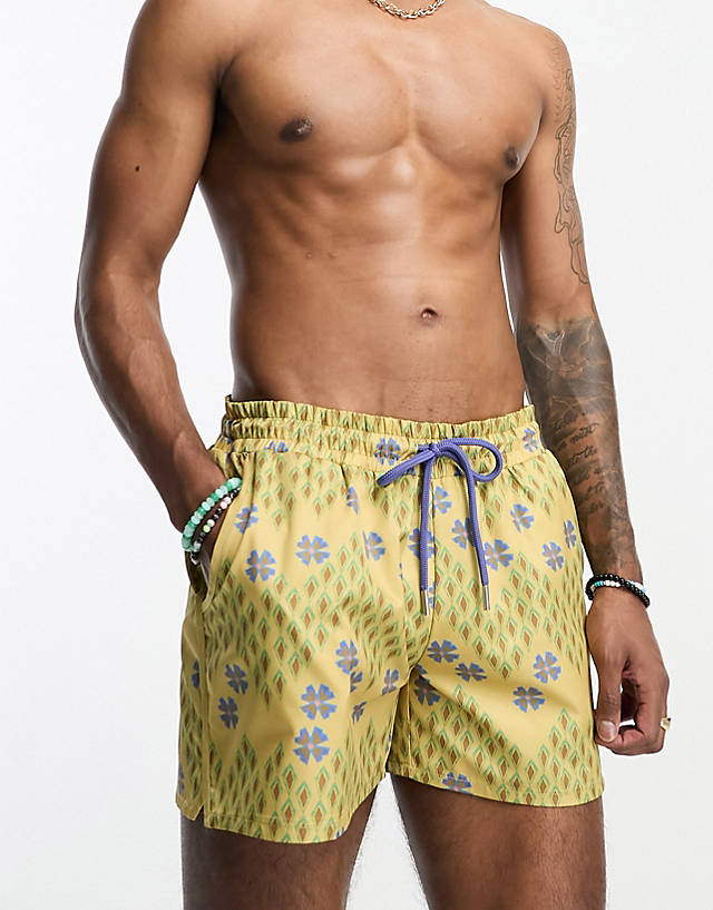 Reclaimed Vintage - swim shorts in short length in geo floral print