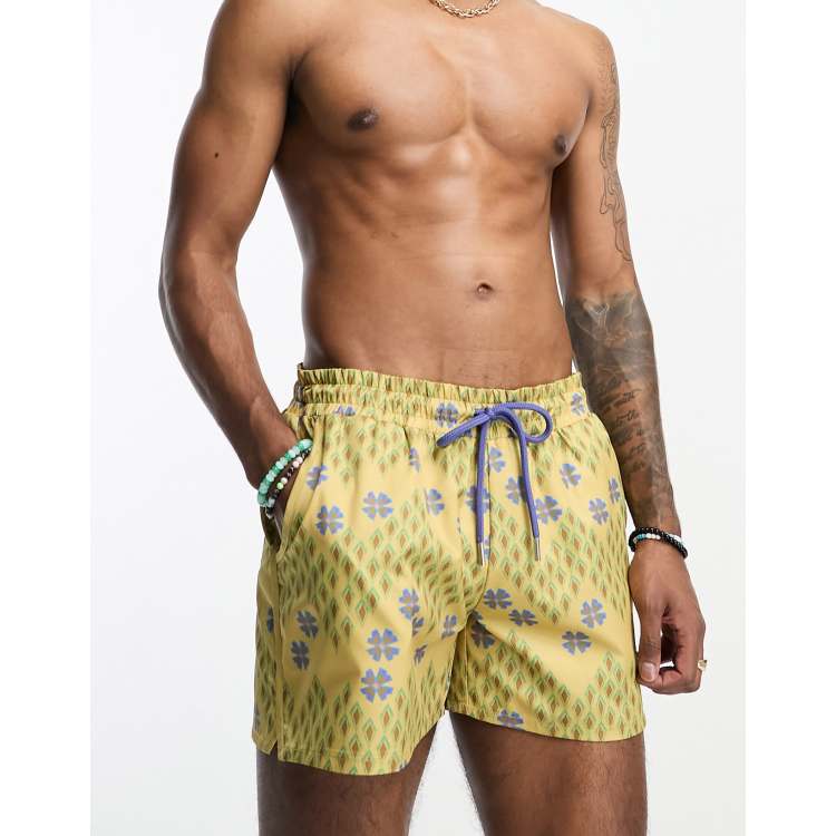 Reclaimed Vintage swim shorts in short length in geo floral print