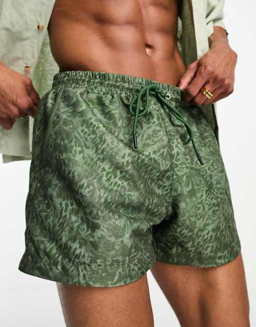 Reclaimed Vintage swim shorts in short length in khaki animal print ASOS