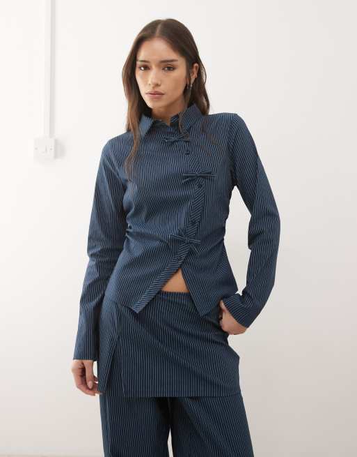 Reclaimed Vintage tie up shirt with bow details in navy pinstripe