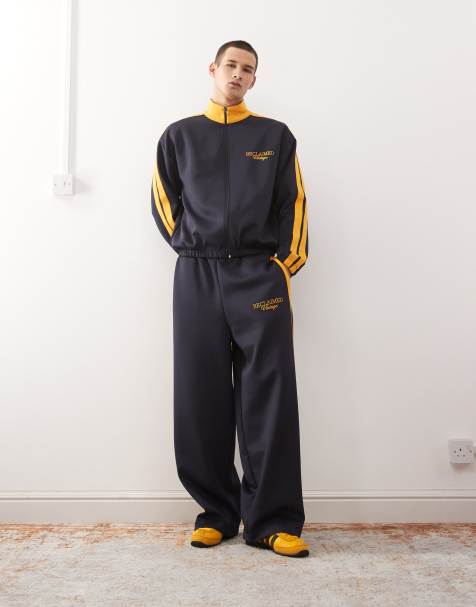 Reclaimed Vintage tracksuit set in navy with side stripe - view 1