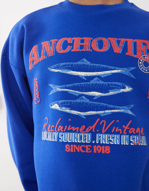 Reclaimed Vintage unisex cropped boxy sweatshirt with fisherman print in blue