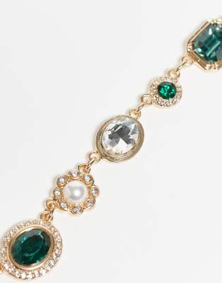 Reclaimed Vintage unisex green rhinestone necklace and bracelet set in gold | ASOS