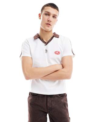 Reclaimed Vintage – Unisex – Krympt pikétröja med randig detalj