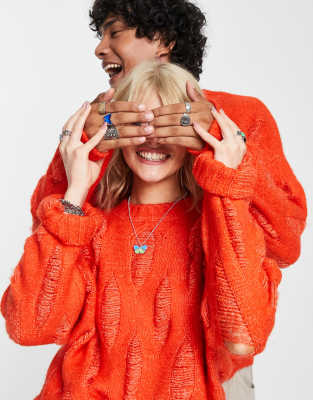 Reclaimed Vintage unisex oversized jumper with laddering and distressing in orange