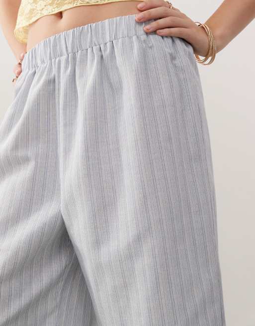 Reclaimed Vintage Unisex oversized longline shorts in blue summer stripes
