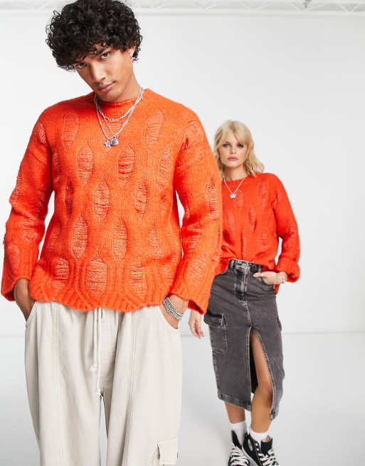 Reclaimed Vintage unisex oversized sweater with laddering and distressing in orange 