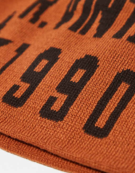 Reclaimed Vintage unisex skull cap beanie with logo in rust