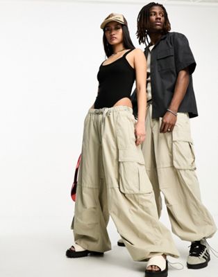 Reclaimed Vintage unisex tech parachute cargo trousers in stone - ASOS Price Checker