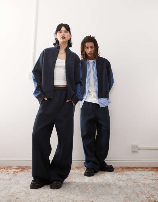 Reclaimed Vintage unisex trackies with side stripe in navy