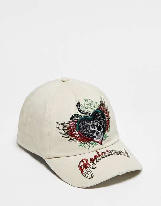 Reclaimed Vintage unisex Y2K skull embroidered trucker cap in washed ecru