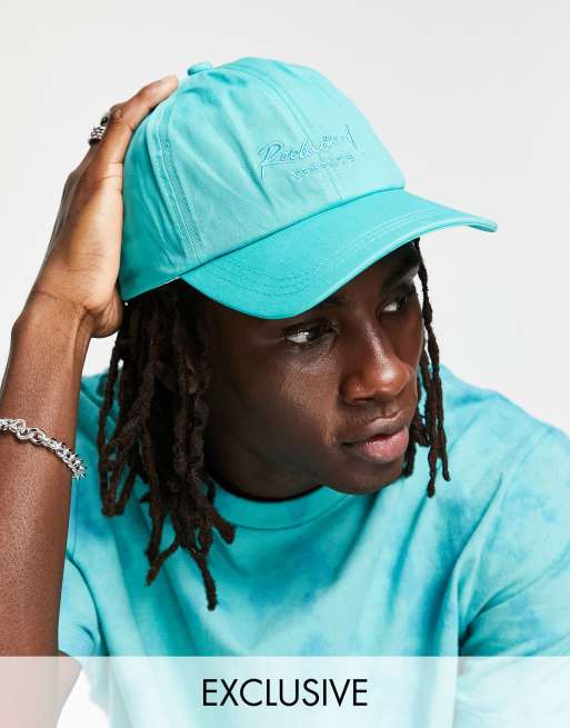 Reclaimed Vintage – Vintageinspirerad ljusblå keps med textlogga