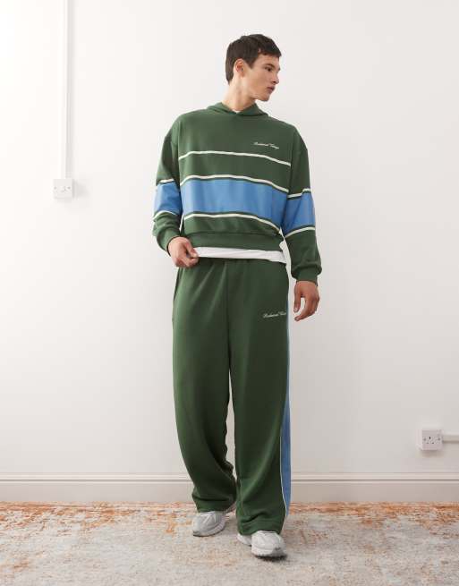 Reclaimed Vintage – Weit geschnittene Jogginghose in Grün mit kontrastierender Seitenbahn, Kombiteil 