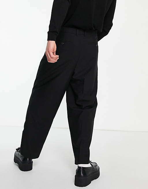 Men Reclaimed vintage wide leg smart trousers in black 