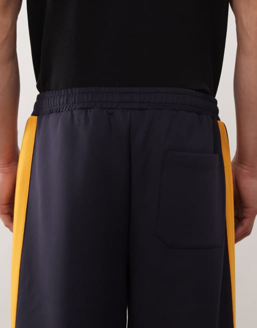 Reclaimed Vintage wide leg sweatpants in navy with side stripes - part of a set