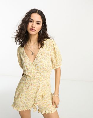Reclaimed Vintage wrap tea playsuit with ruffles in yellow ditsy floral