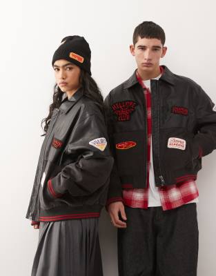Reclaimed Vintage Reclaimed Vintage x Stranger Things unisex faux leather bomber with cord panel and mixed badges in black