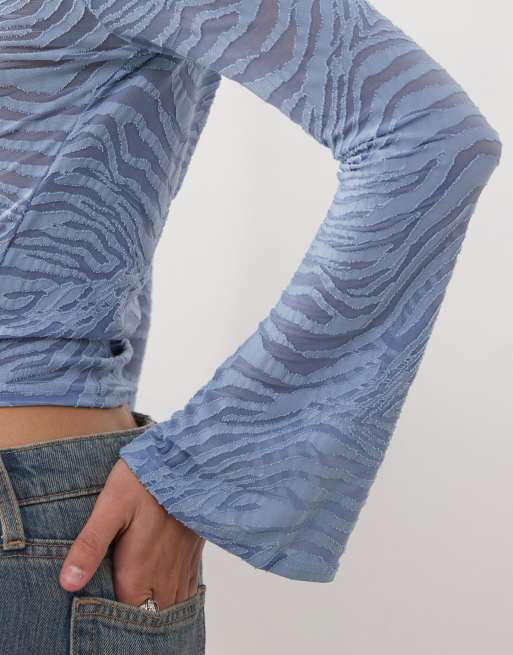 Reclaimed Vintage zebra burnout flare sleeve top in blue