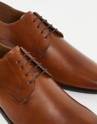 red tape tan derby shoes