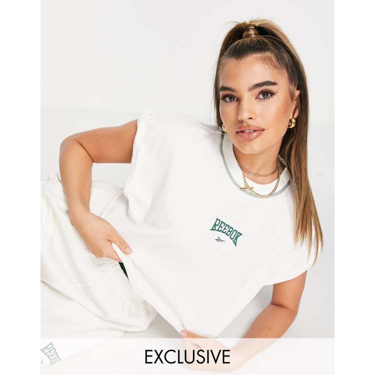 Reebok Racerback Bra Top With Oversized Logo at asos.com