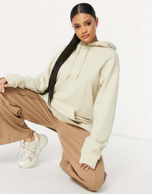 Reebok – Beżowa bluza z kapturem i logo na środku – BEIGE