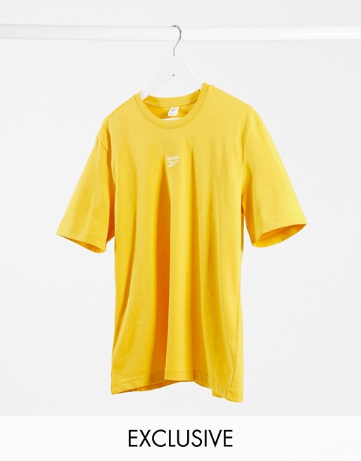 Reebok boyfriend fit t-shirt with central logo in yellow exclusive to ASOS