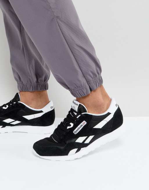 Reebok classic black on sale and white nylon trainers