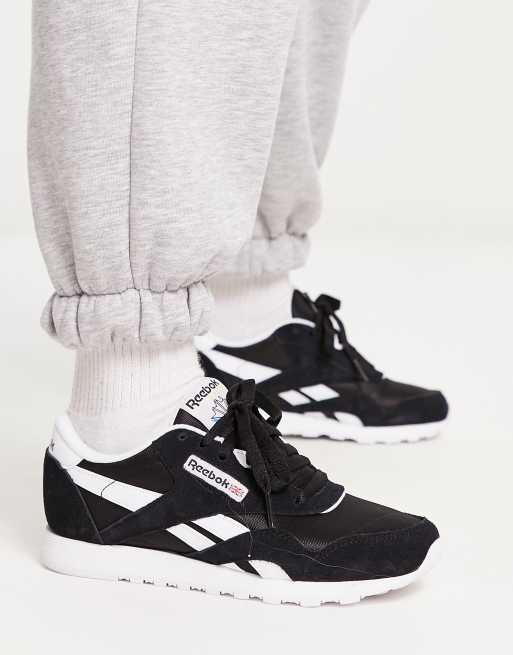 Reebok black hot sale and white trainers