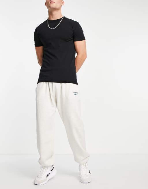 Reebok Classics - Joggers color bianco sporco con logo vector