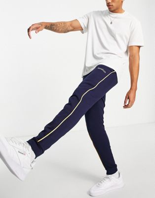 Reebok Classics logo joggers with piping in navy