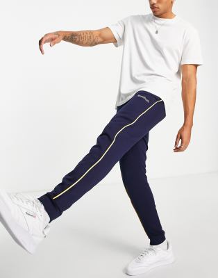 Reebok Classics logo joggers with piping in navy