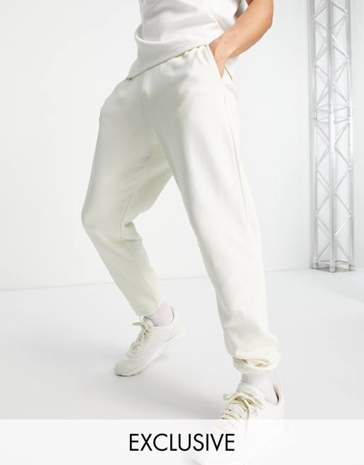 Reebok Classics trackies with central logo in off white Exclusive to ASOS