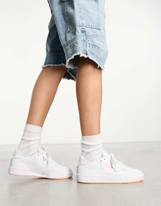 Reebok Club C 85 sneakers in white with peach detail