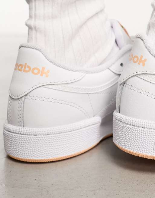 Reebok Club C 85 sneakers in white with peach detail