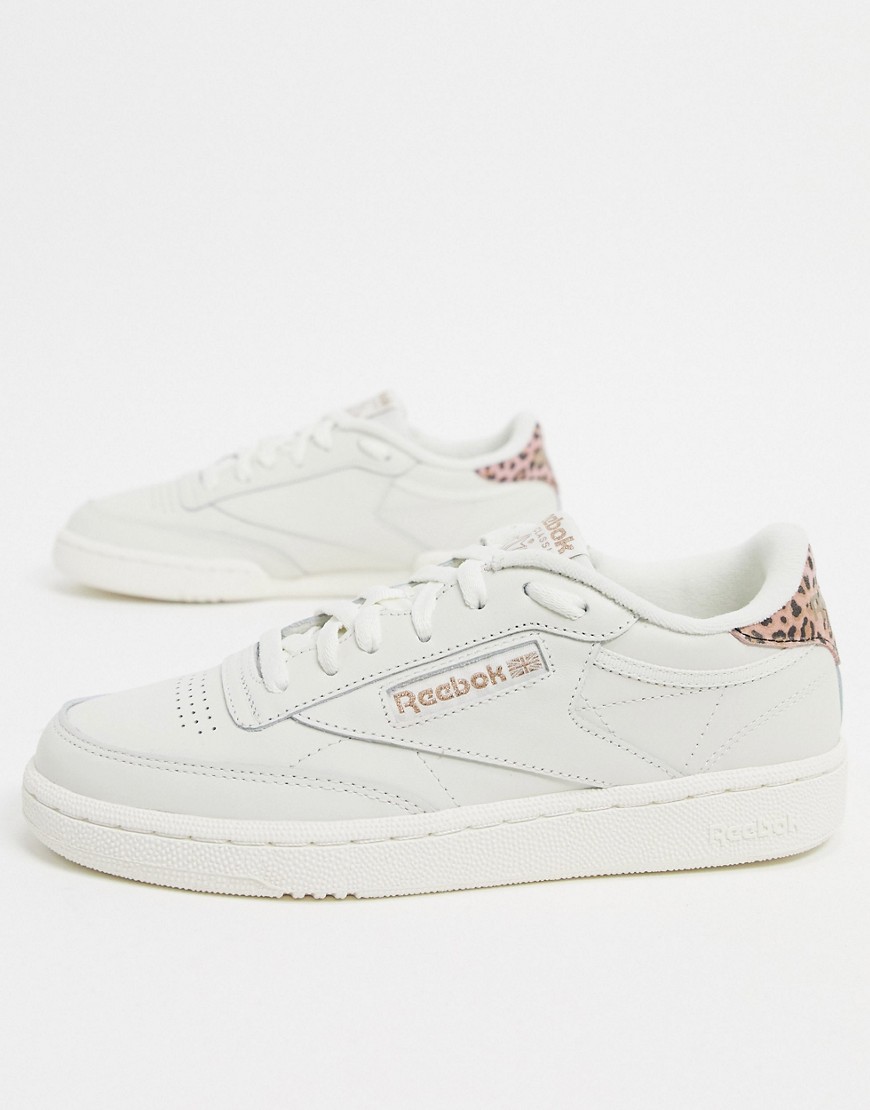 Reebok Club C 85 trainers in white with pink leopard print heel detail