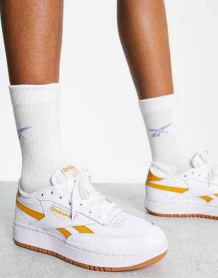 white and orange reebok