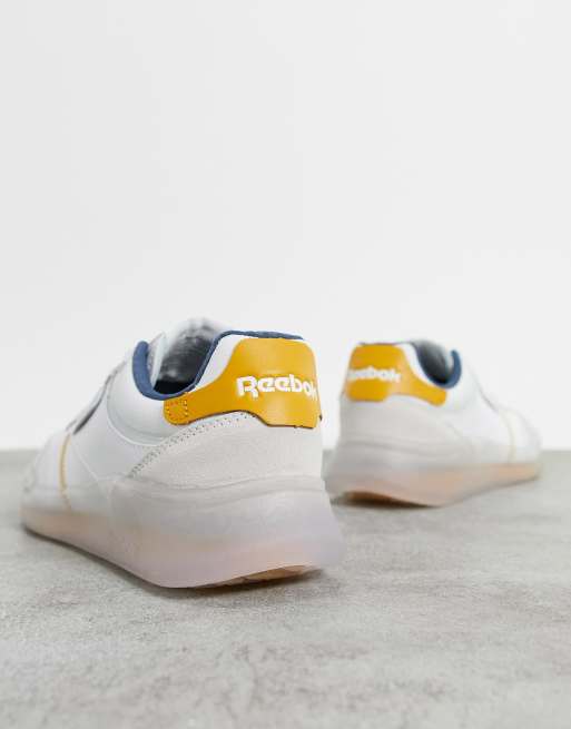 Reebok Club C Legacy trainers in white with orange detailing