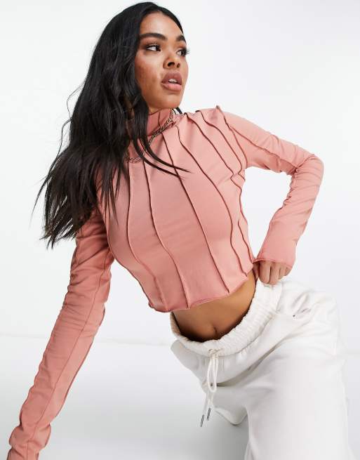 Reebok - Crop top met lange mouwen en zichtbare naden in roze