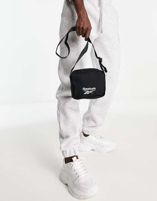 Reebok cross body bag in black | ASOS