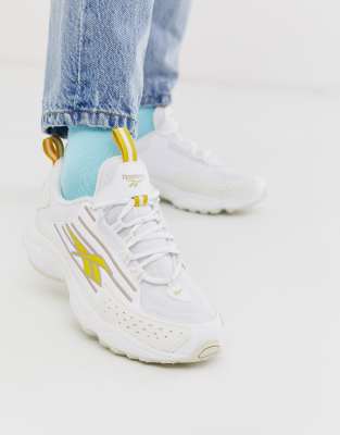 white and yellow reebok