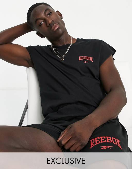 Reebok drop sleeve tank top in black - Exclusive to ASOS