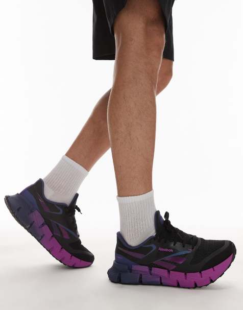 Reebok – Floatzig – Laufschuhe in Schwarz und Lila - view 1