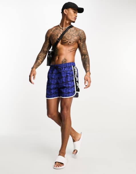 Reebok – Gadial – Badeshorts mit Print in Blau und Schwarz - view 1