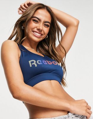 Reebok Gina racer back logo crop sports bra in blue - ASOS Price Checker