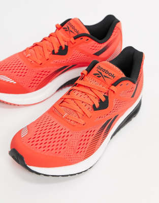 orange reebok trainers