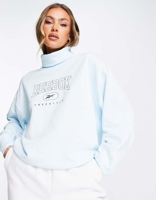 Reebok high neck sweatshirt in blue ASOS