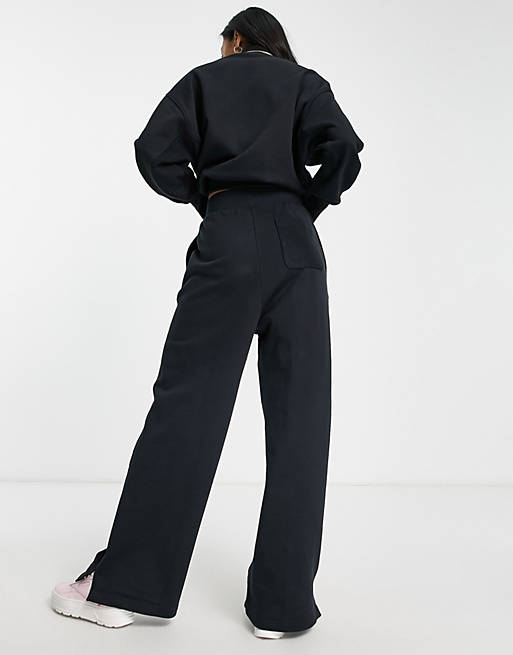 Reebok high waisted wide leg trousers in black | ASOS